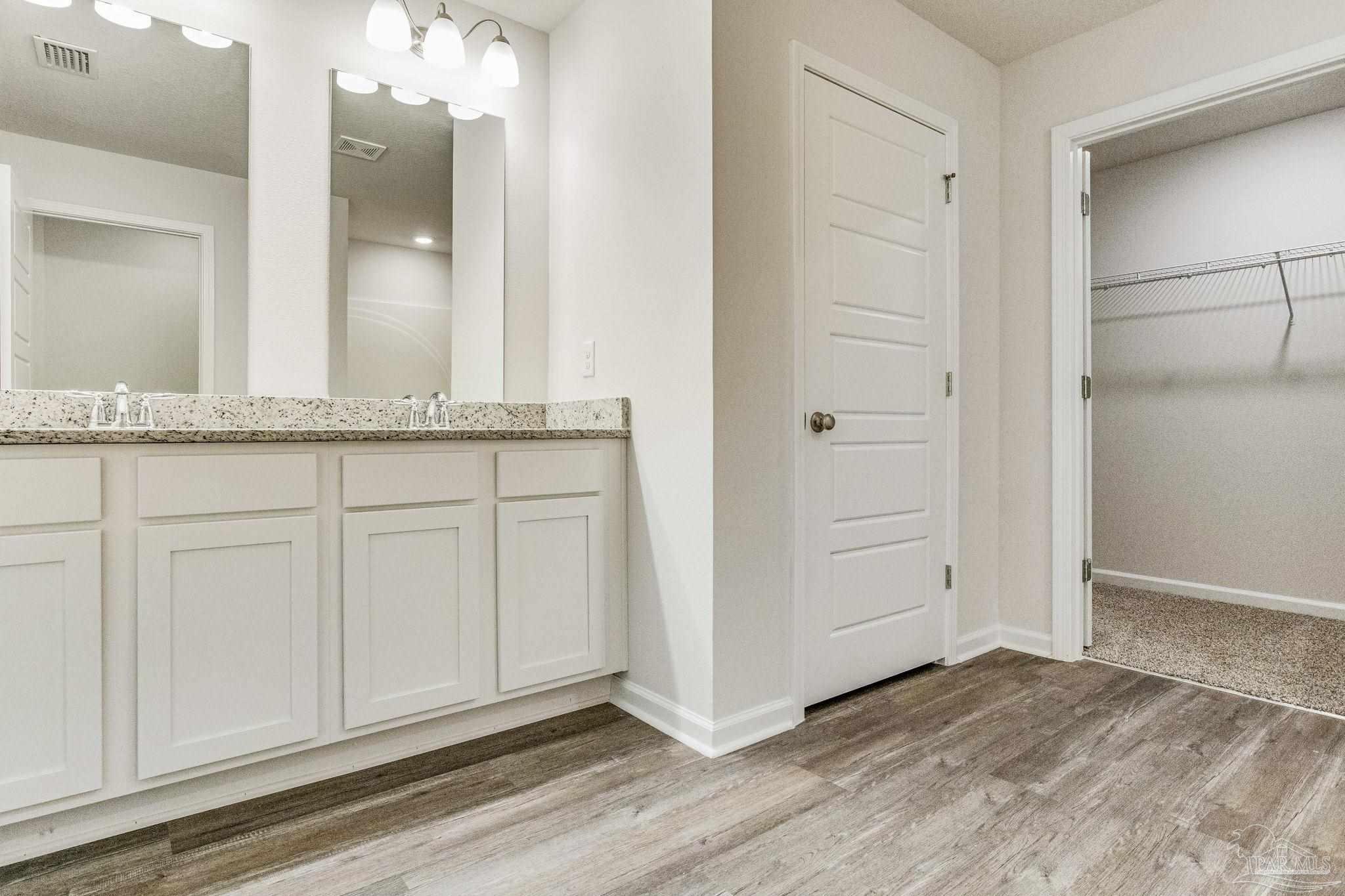 9823 MilleeLoop Loop Pensacola, FL 32526 - Photo 21 of 50 a view of a kitchen from the hallway