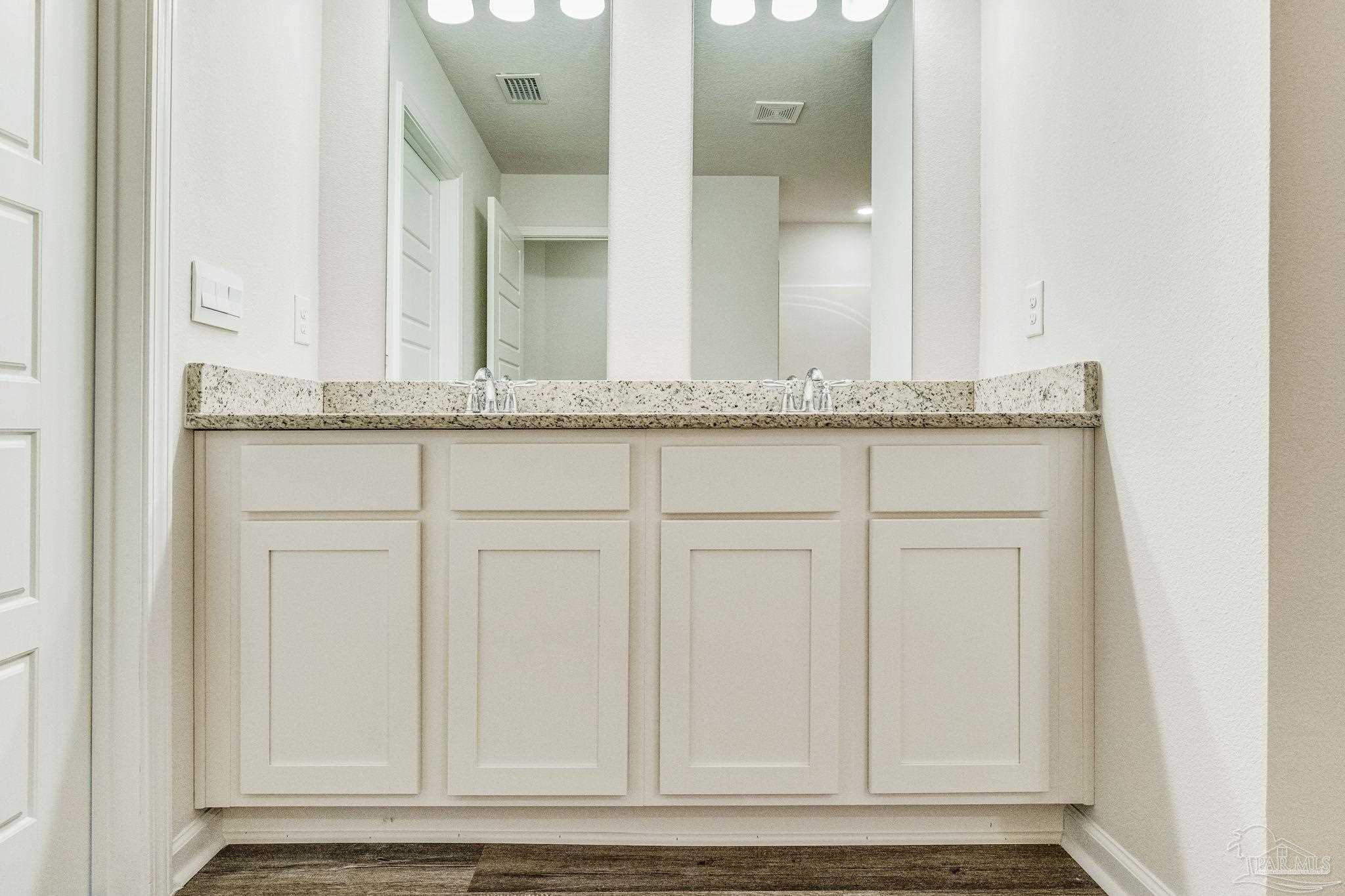 9823 MilleeLoop Loop Pensacola, FL 32526 - Photo 22 of 50 a bathroom with a granite countertop sink and a mirror