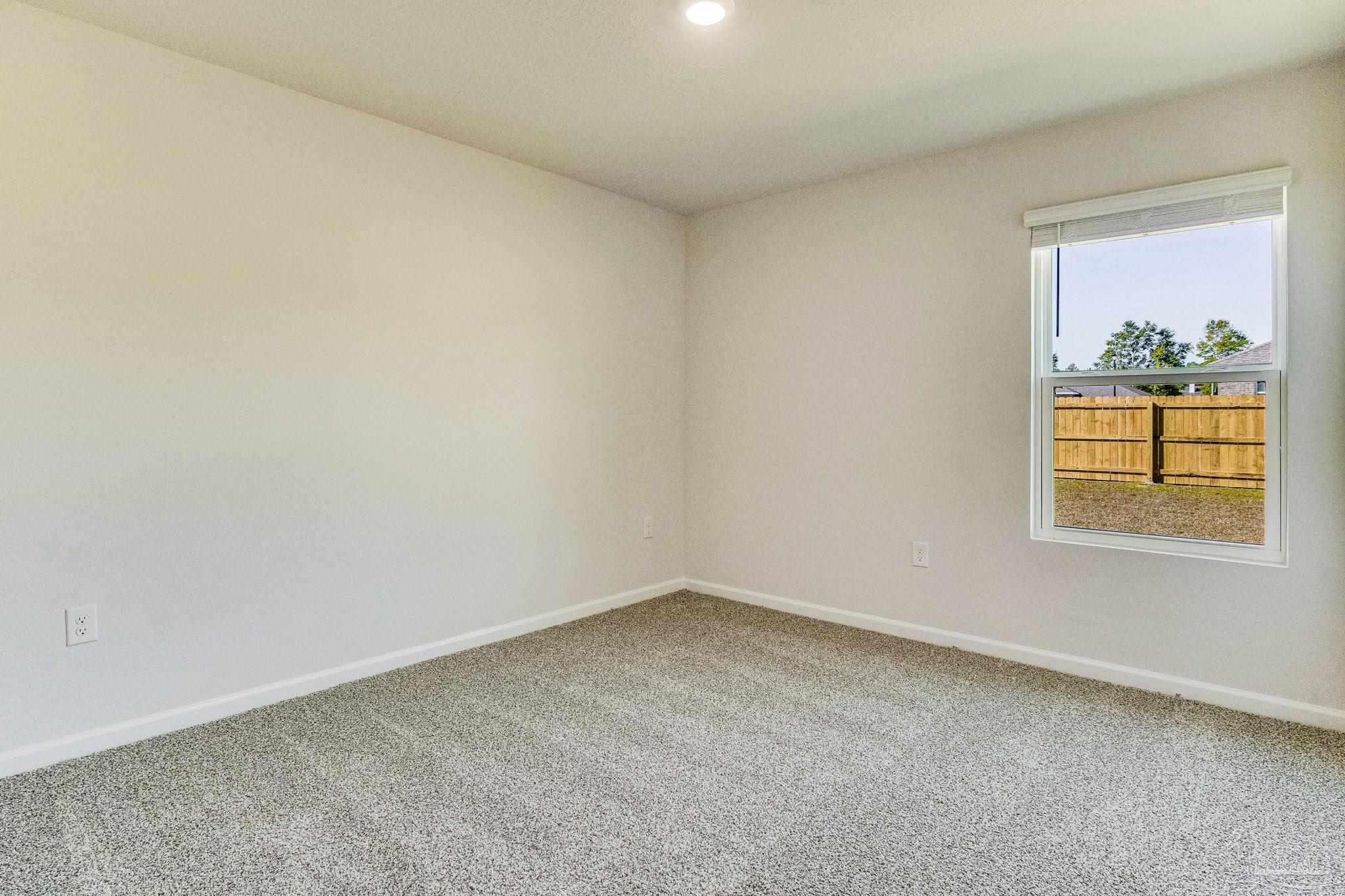 9823 MilleeLoop Loop Pensacola, FL 32526 - Photo 26 of 50 an empty room with a window