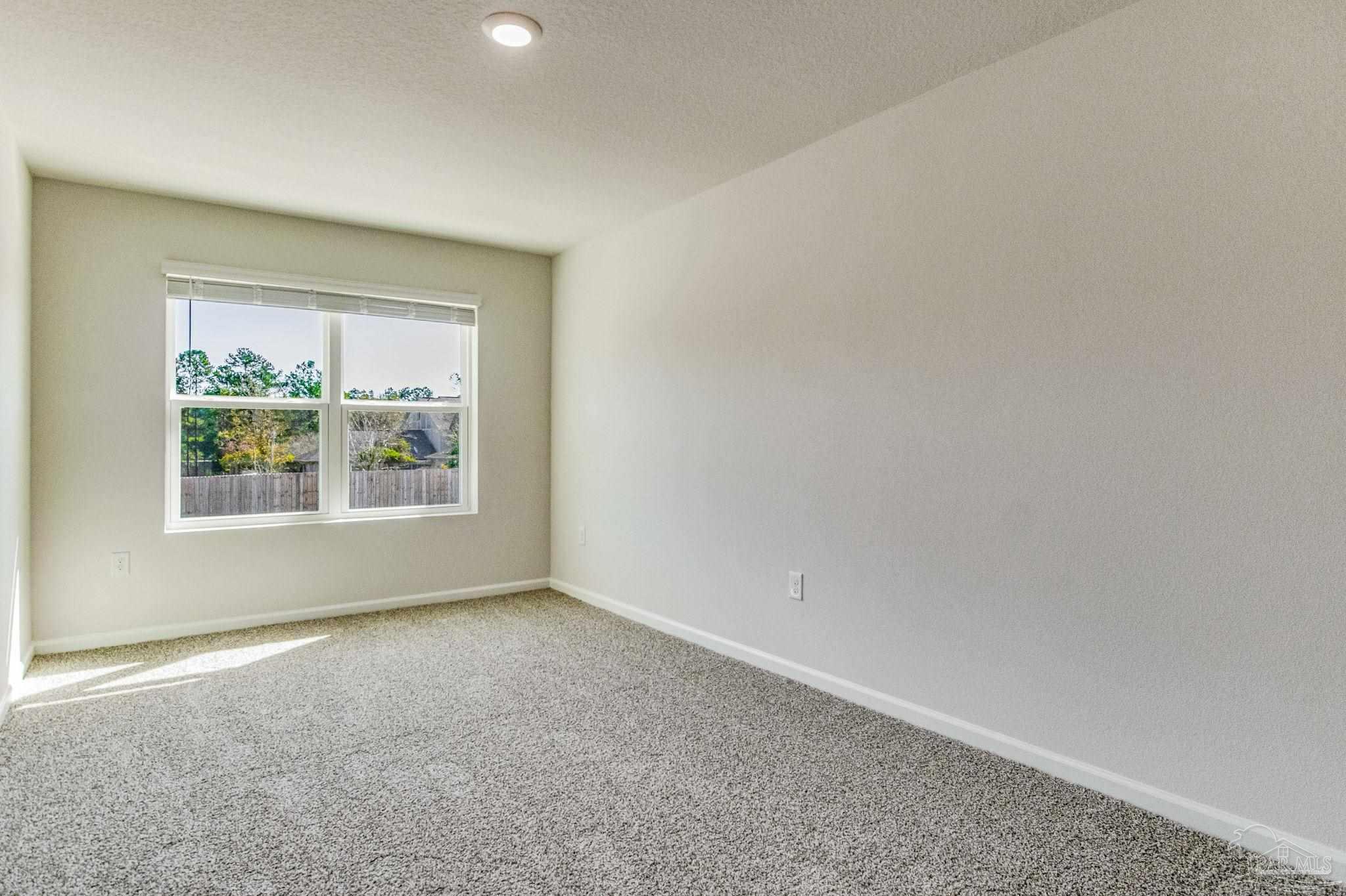 9823 MilleeLoop Loop Pensacola, FL 32526 - Photo 29 of 50 a view of an empty room with a window
