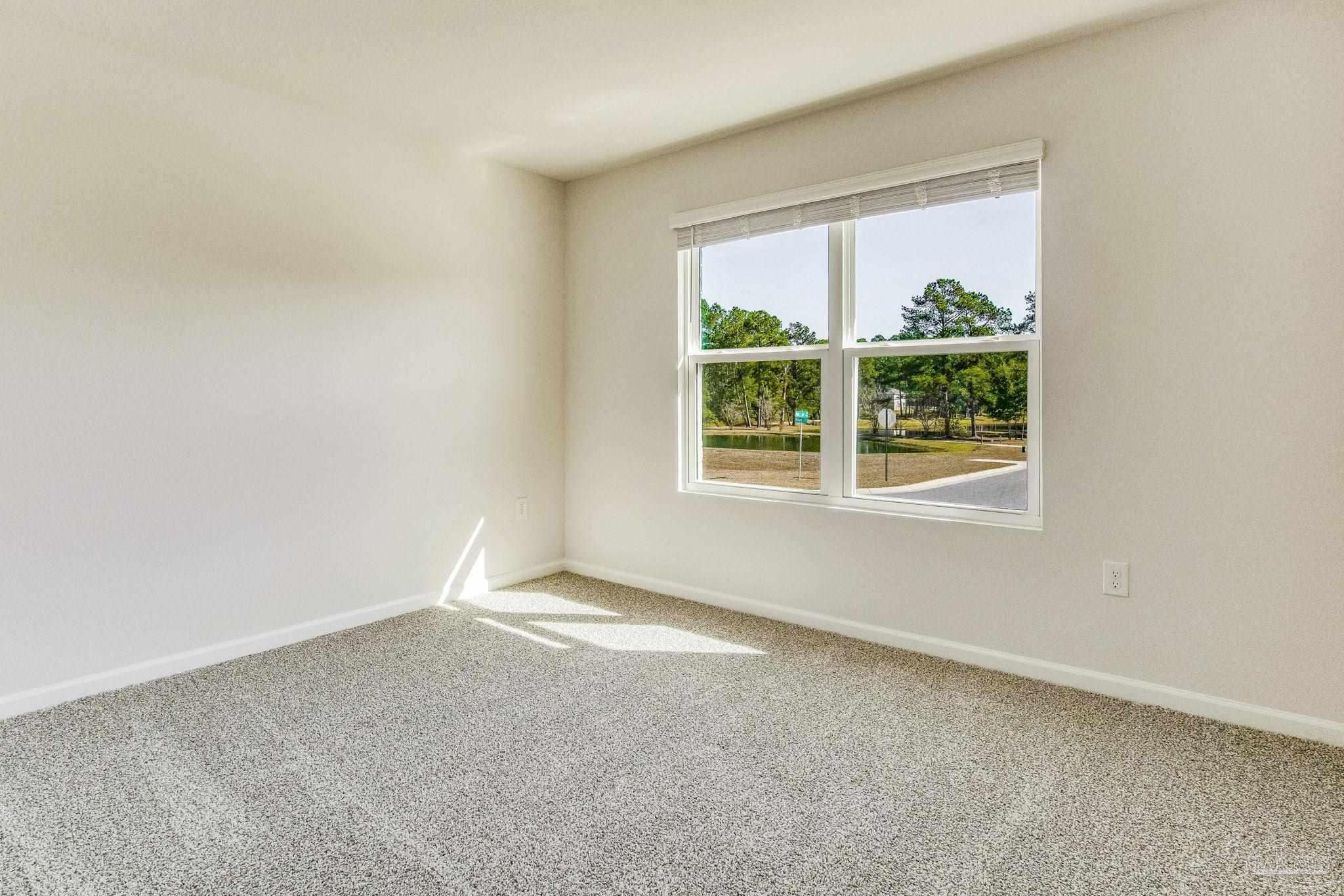 9823 MilleeLoop Loop Pensacola, FL 32526 - Photo 32 of 50 an empty room with a window