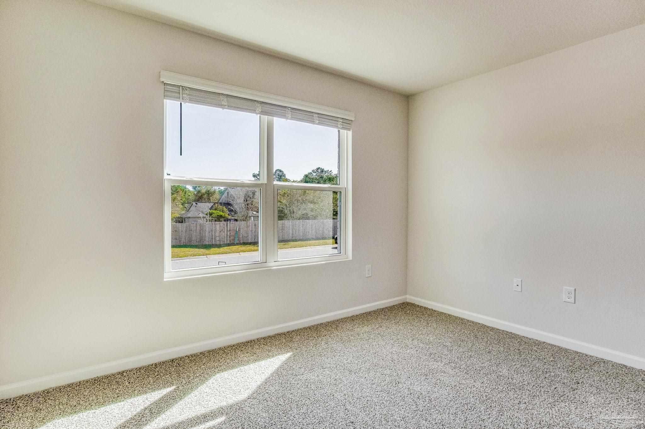 9823 MilleeLoop Loop Pensacola, FL 32526 - Photo 33 of 50 an empty room with a window