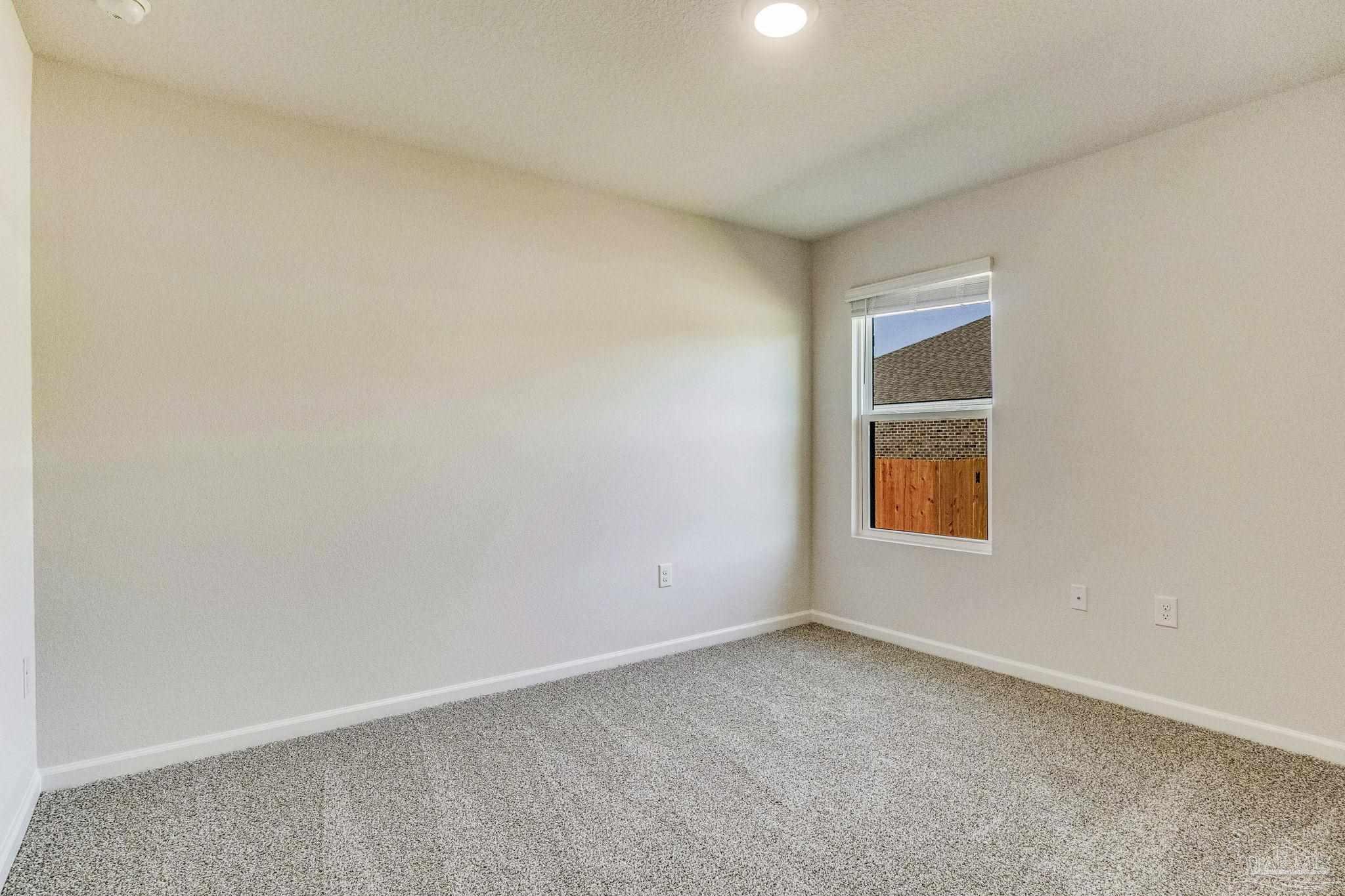 9823 MilleeLoop Loop Pensacola, FL 32526 - Photo 35 of 50 a view of an empty room with a window