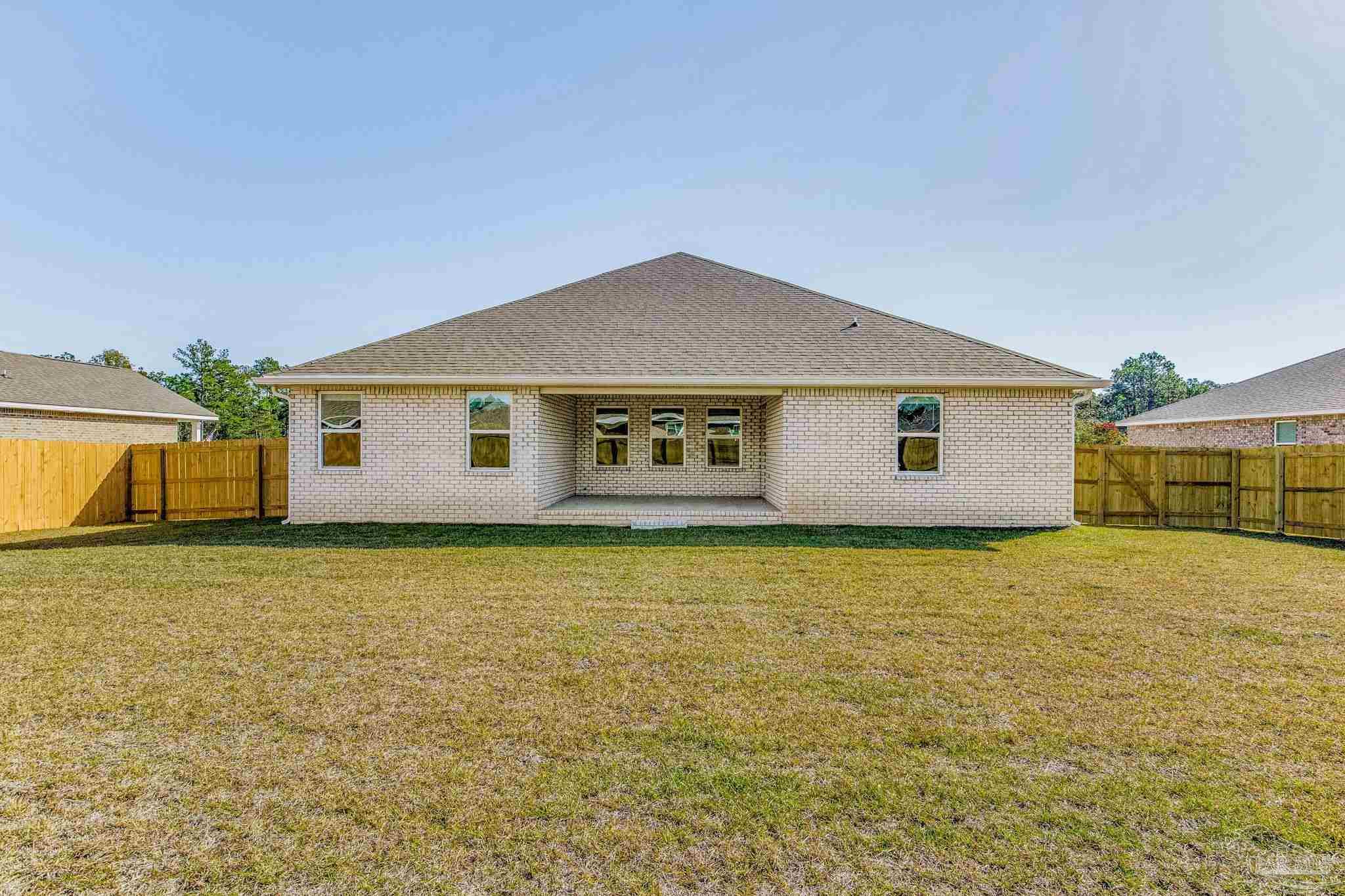 9823 MilleeLoop Loop Pensacola, FL 32526 - Photo 46 of 50 a house with swimming pool in front of it