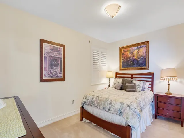 a bedroom with a large bed and a view of bedroom