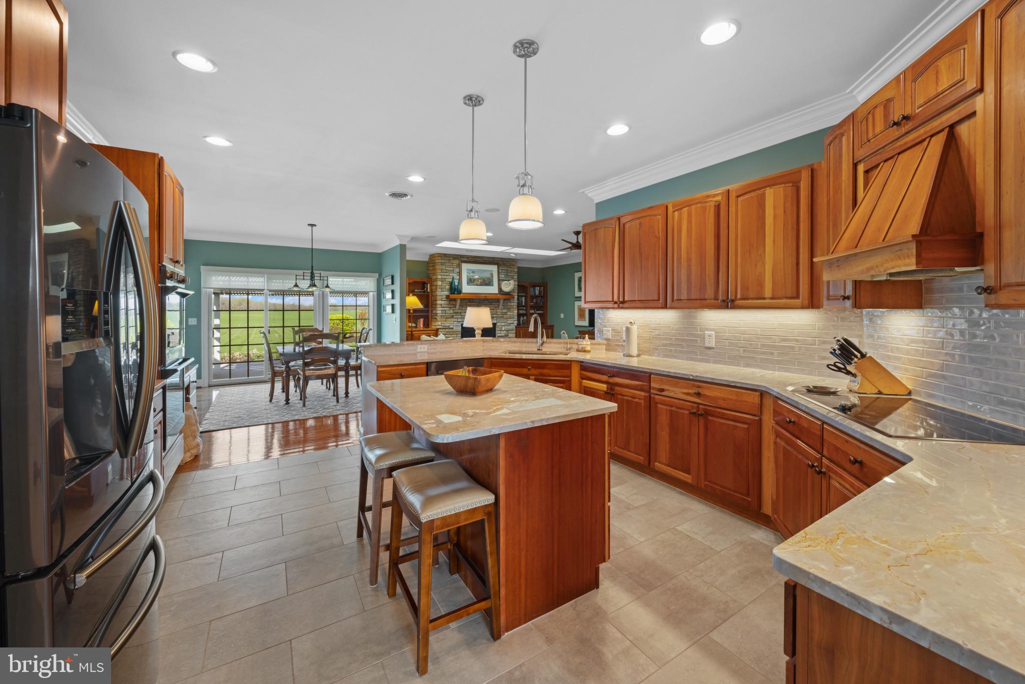 209 Beck Farm Road Centreville, MD 21617 - Photo 12 of 55 a kitchen with stainless steel appliances granite countertop a sink a stove and a refrigerator