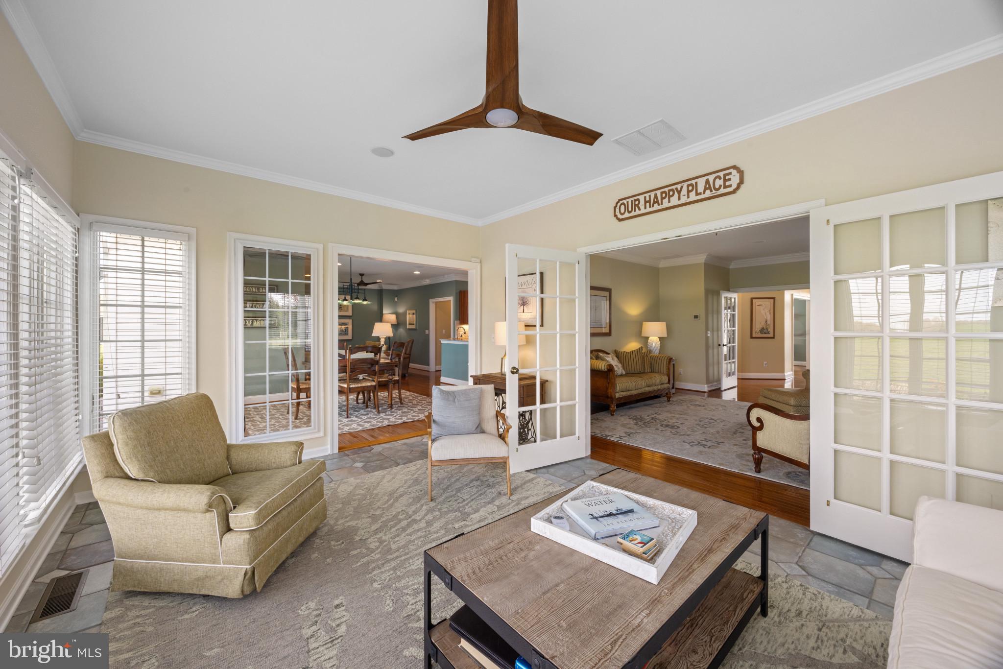 209 Beck Farm Road Centreville, MD 21617 - Photo 17 of 55 a living room with furniture a rug and a table