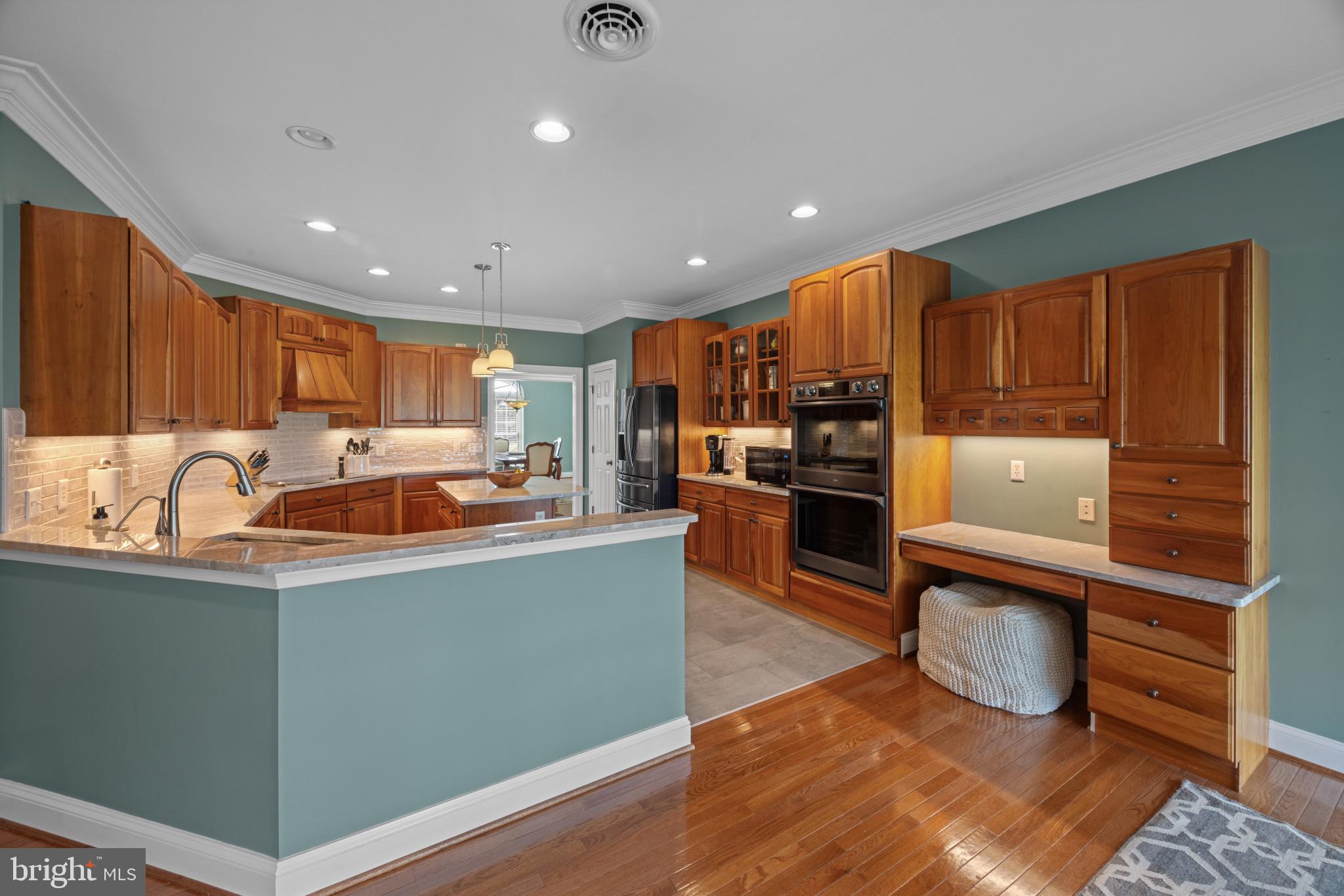 209 Beck Farm Road Centreville, MD 21617 - Photo 19 of 55 a kitchen with stainless steel appliances granite countertop a refrigerator stove top oven and sink