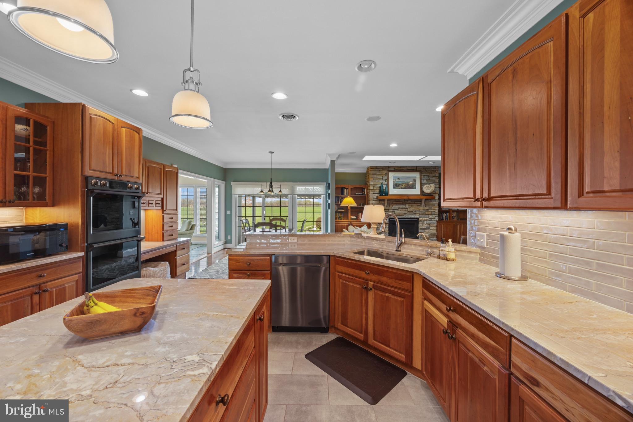 209 Beck Farm Road Centreville, MD 21617 - Photo 20 of 55 a kitchen with stainless steel appliances granite countertop a sink and a stove
