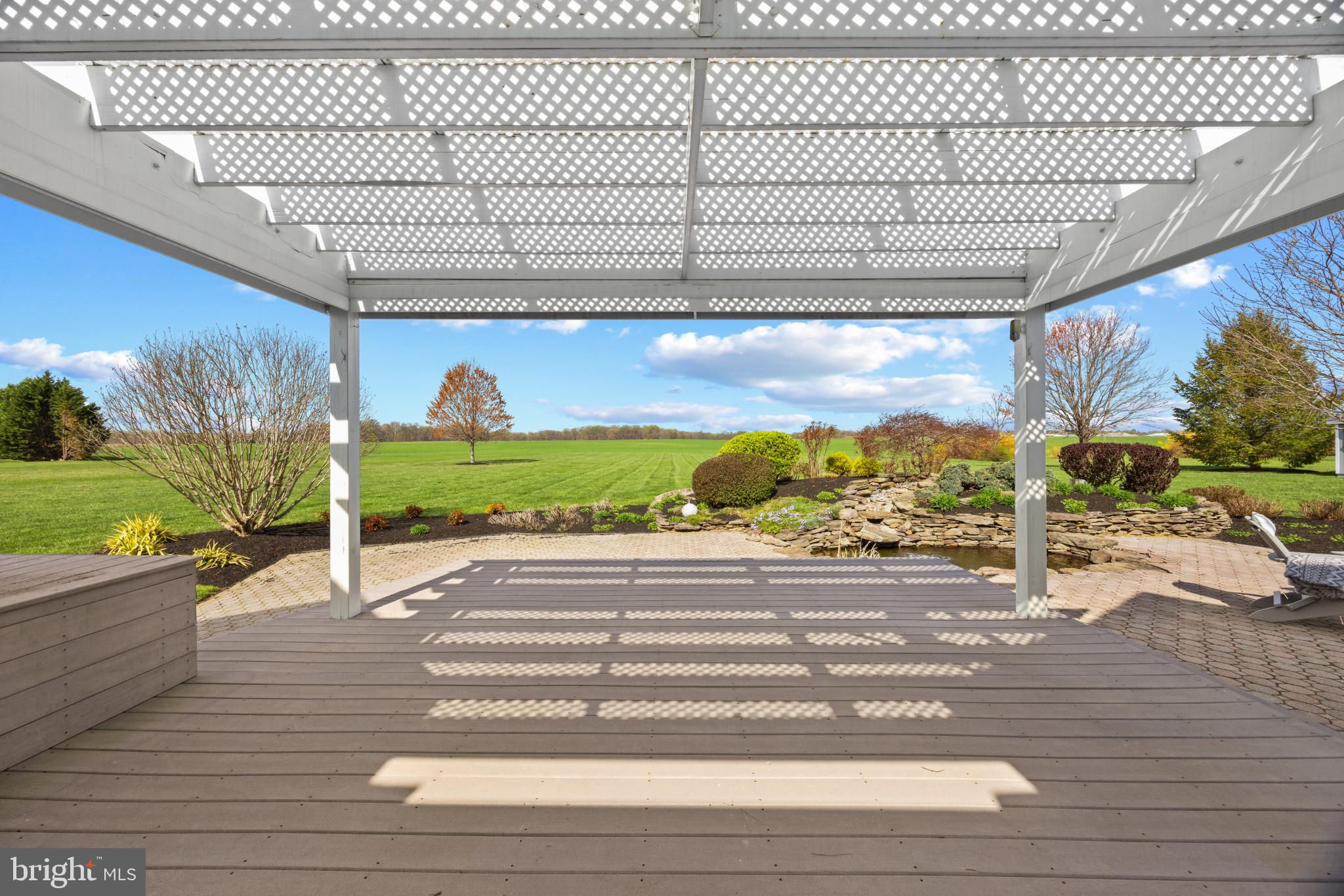 209 Beck Farm Road Centreville, MD 21617 - Photo 2 of 55 a view of a room with wooden floor and fence