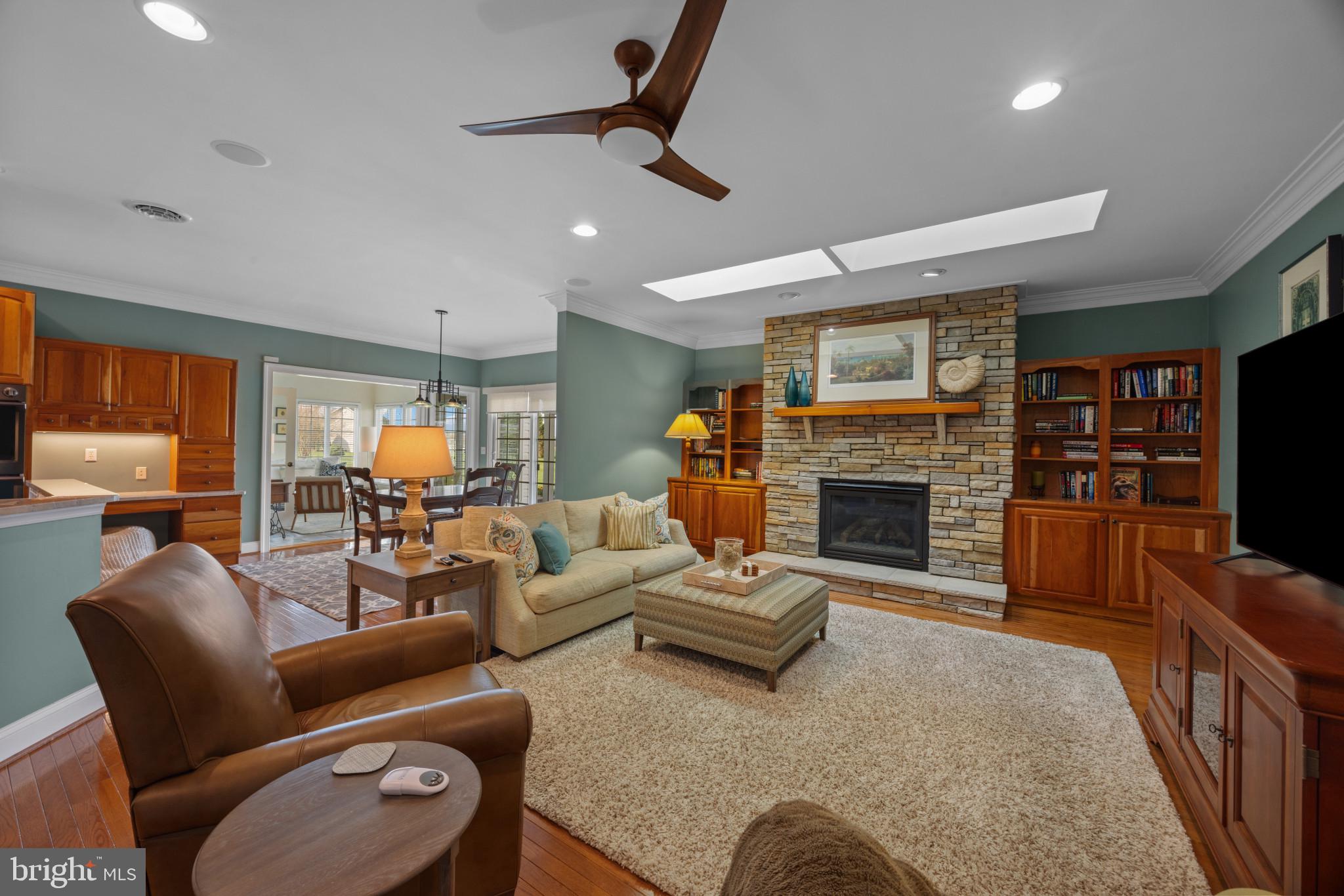 209 Beck Farm Road Centreville, MD 21617 - Photo 22 of 55 a living room with furniture a fireplace and a flat screen tv
