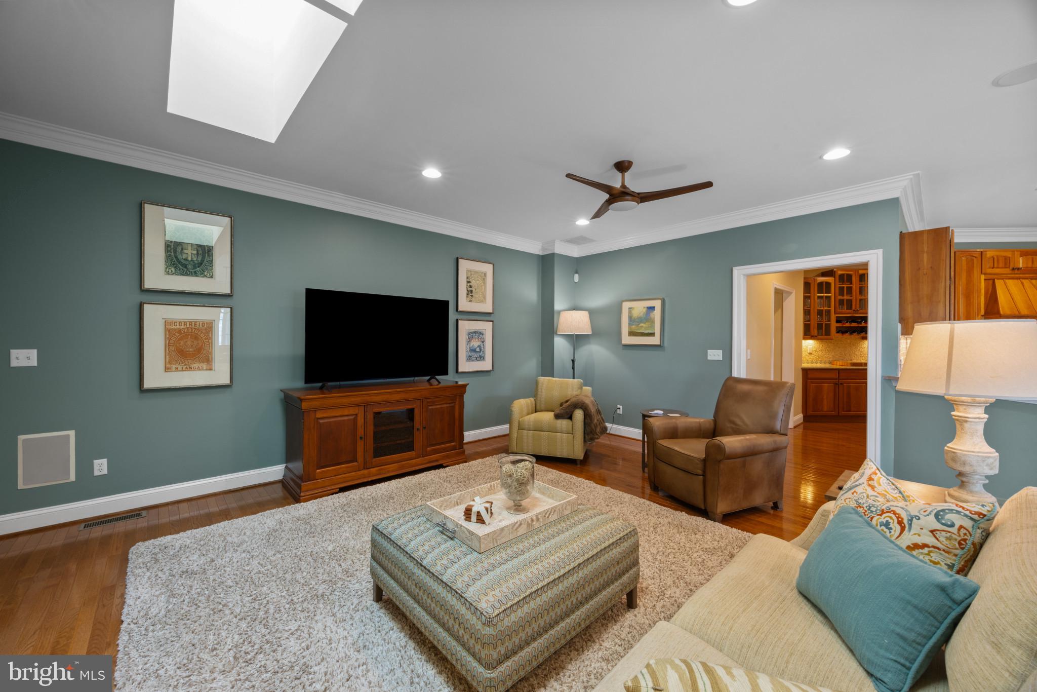209 Beck Farm Road Centreville, MD 21617 - Photo 24 of 55 a living room with furniture a flat screen tv and a table