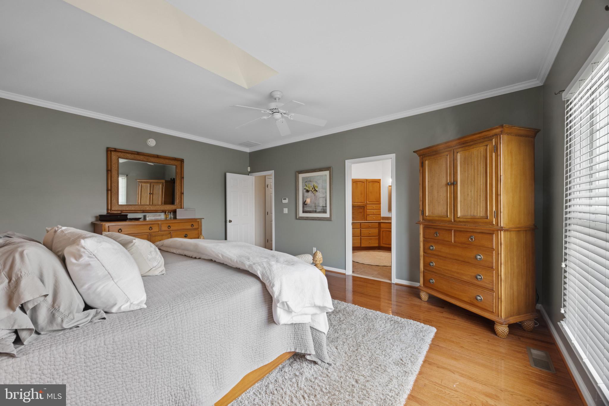 209 Beck Farm Road Centreville, MD 21617 - Photo 27 of 55 a bedroom with a large bed and a window