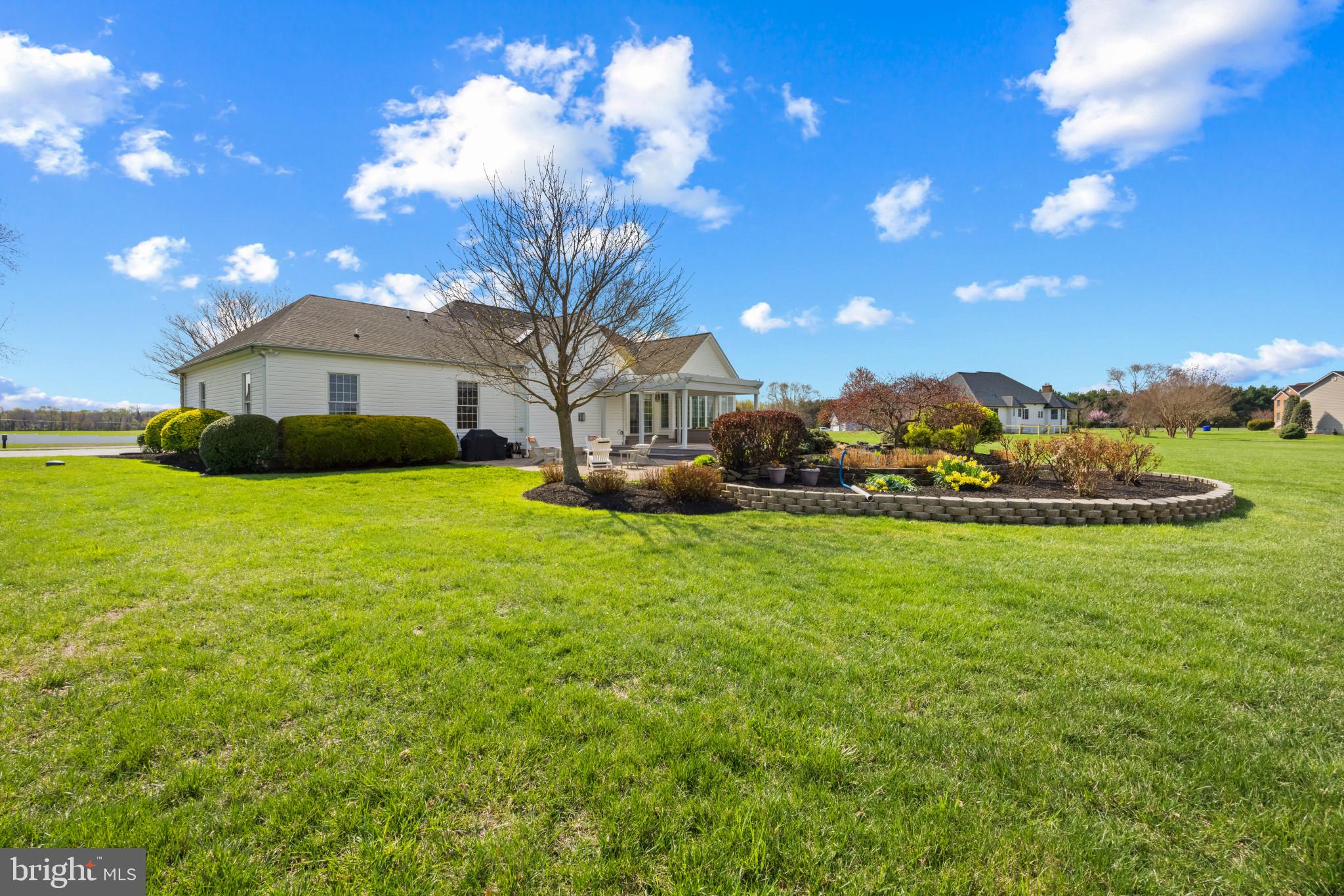 209 Beck Farm Road Centreville, MD 21617 - Photo 41 of 55 a front view of a house with garden