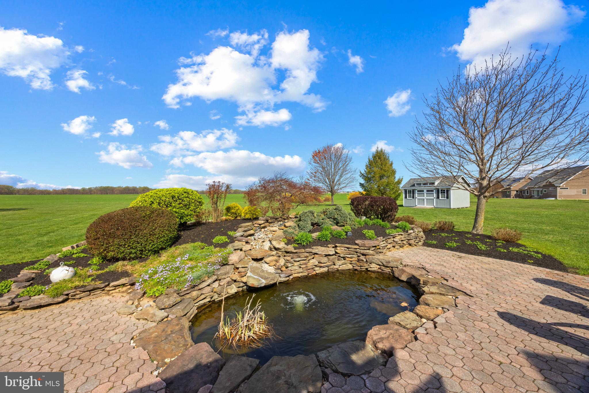 209 Beck Farm Road Centreville, MD 21617 - Photo 45 of 55 a view of a lake with a yard