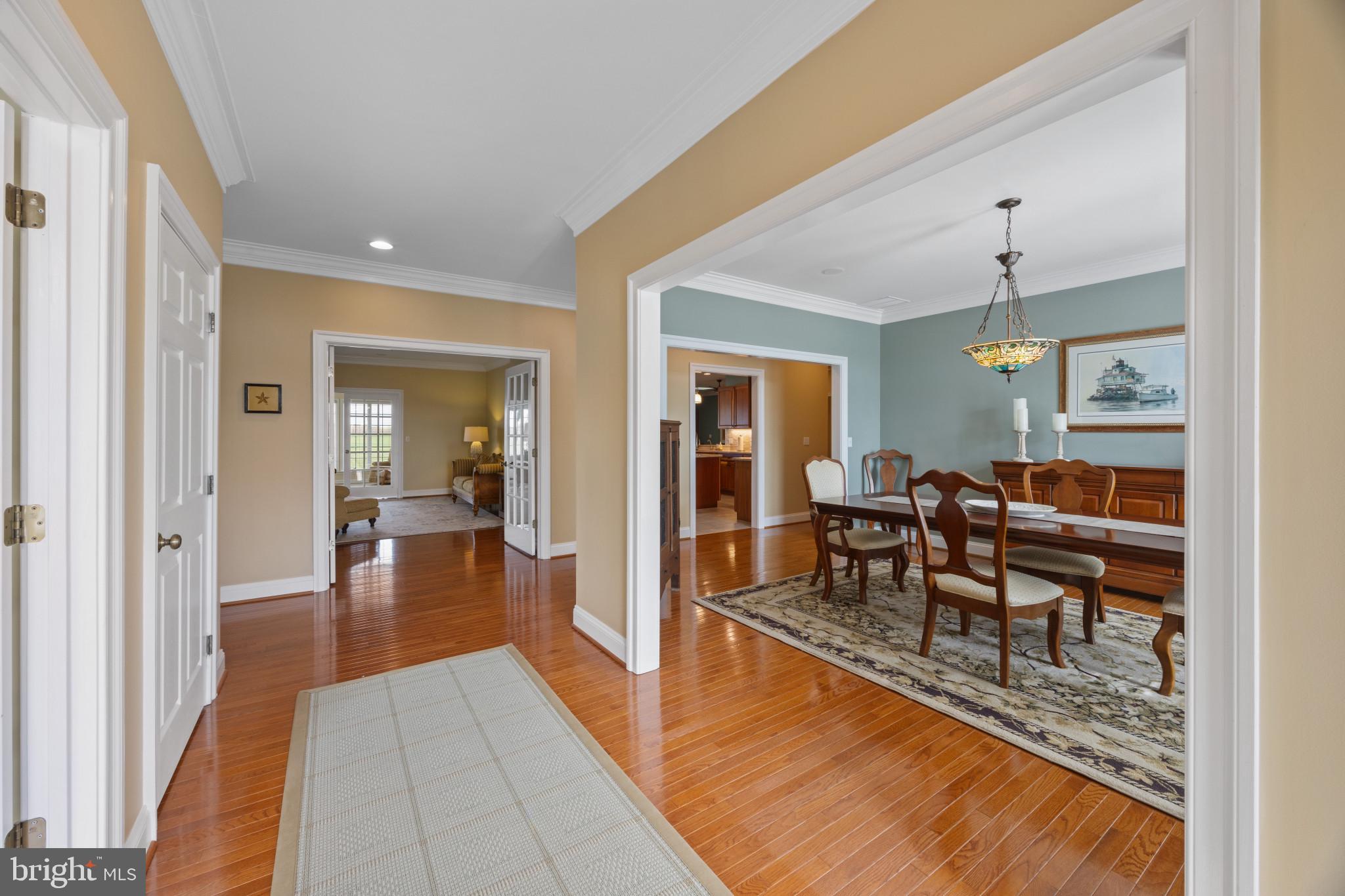 209 Beck Farm Road Centreville, MD 21617 - Photo 5 of 55 a dining room filled with furniture and wooden floor