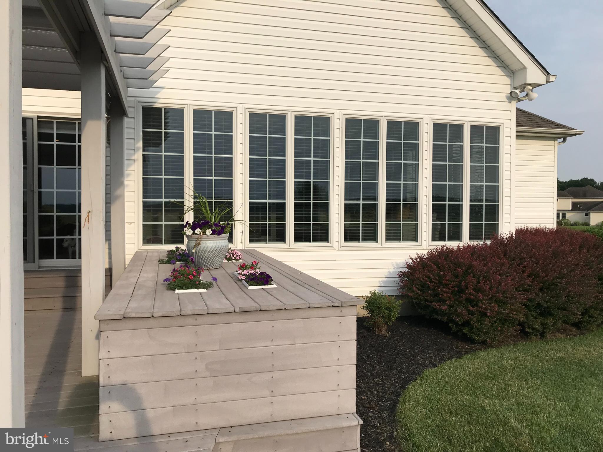 209 Beck Farm Road Centreville, MD 21617 - Photo 52 of 55 a front view of a house with glass windows