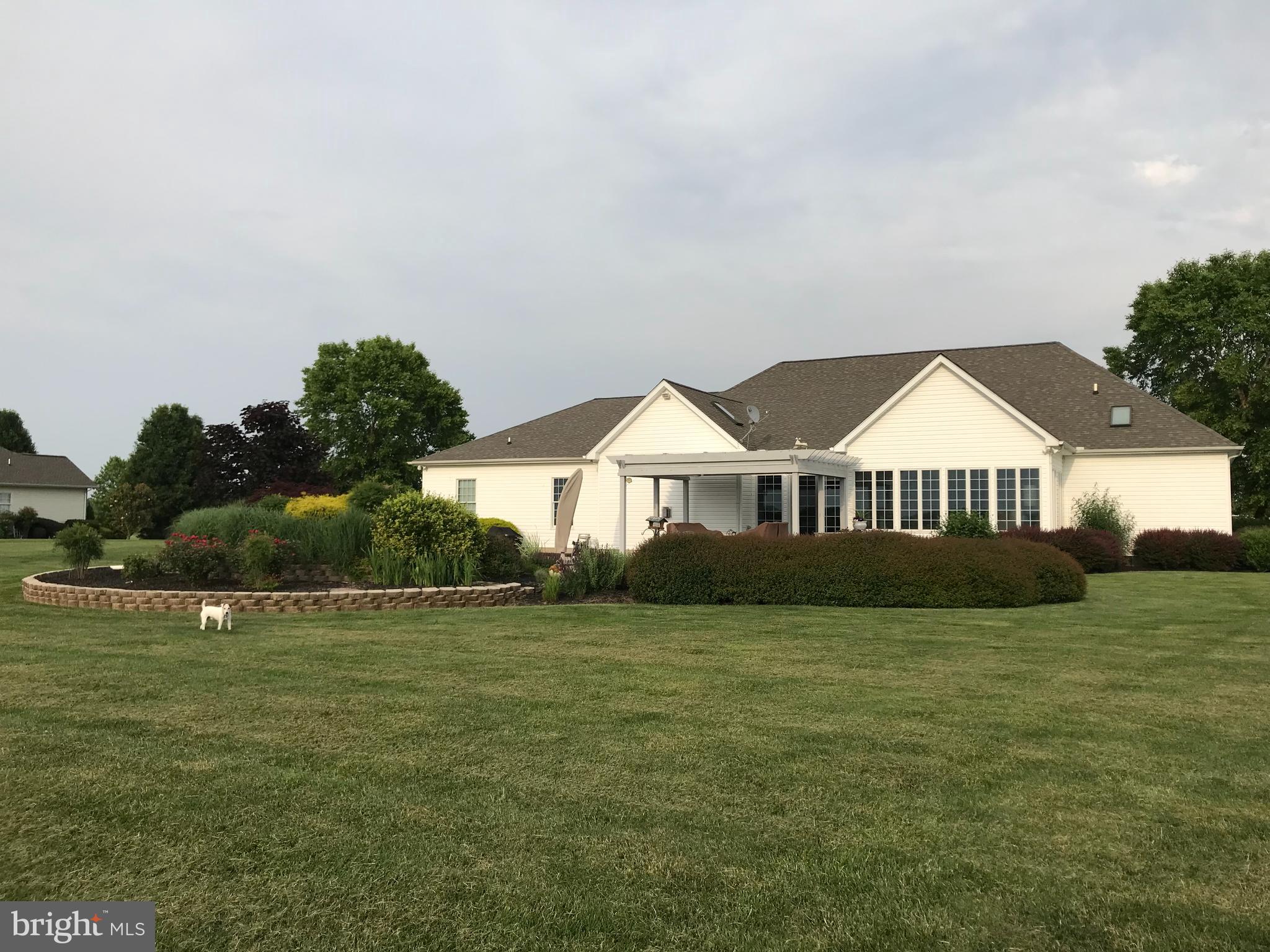 209 Beck Farm Road Centreville, MD 21617 - Photo 54 of 55 a house with a garden