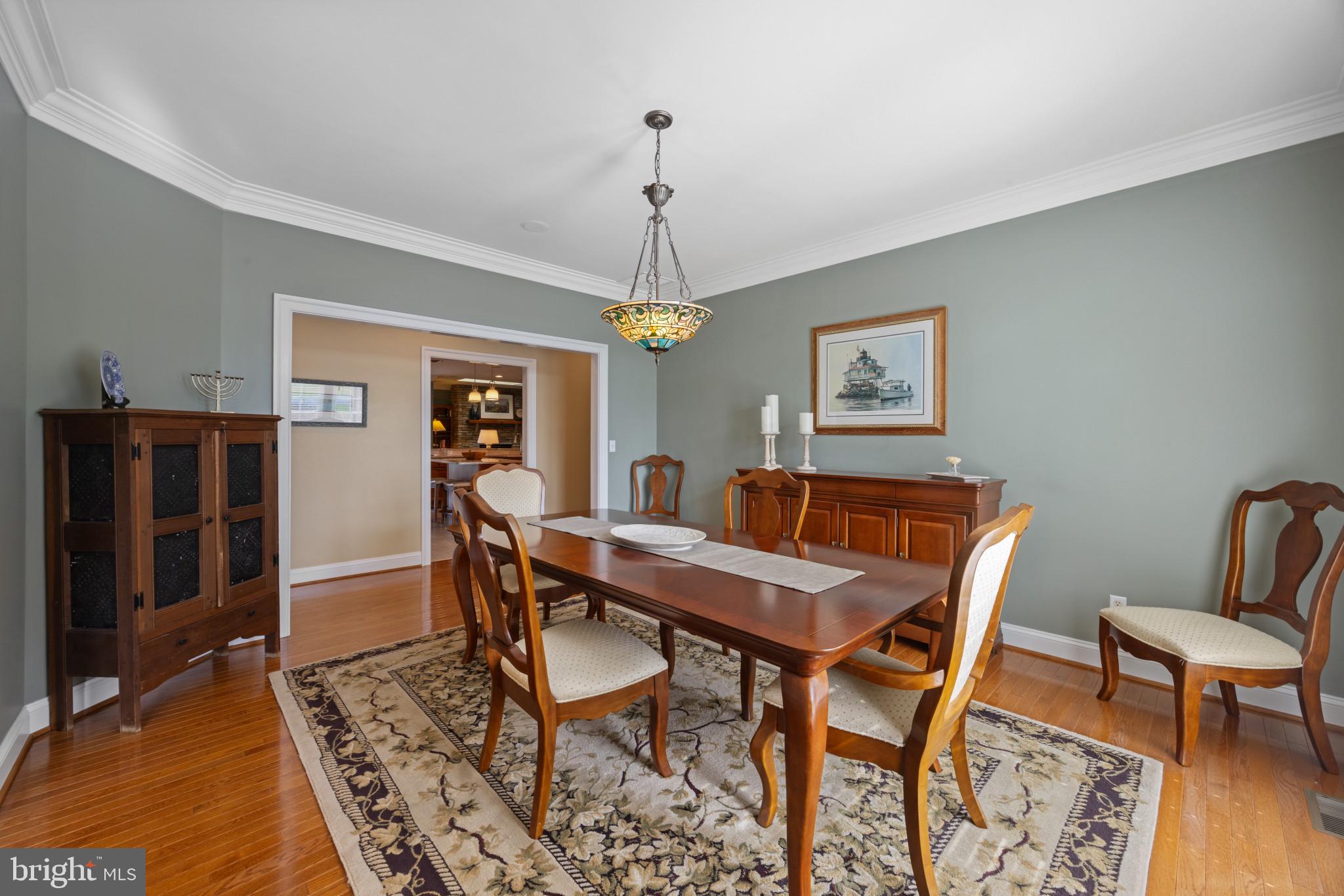 209 Beck Farm Road Centreville, MD 21617 - Photo 6 of 55 a view of a dining room with furniture window and wooden floor