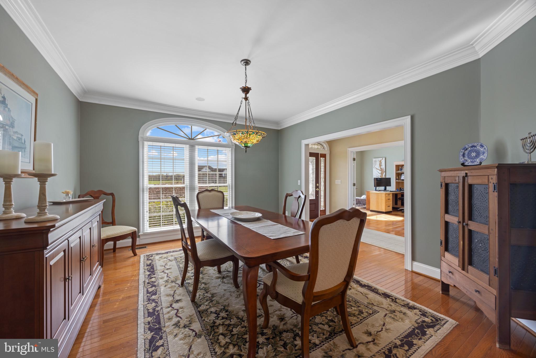 209 Beck Farm Road Centreville, MD 21617 - Photo 7 of 55 a view of a dining room with furniture window and wooden floor