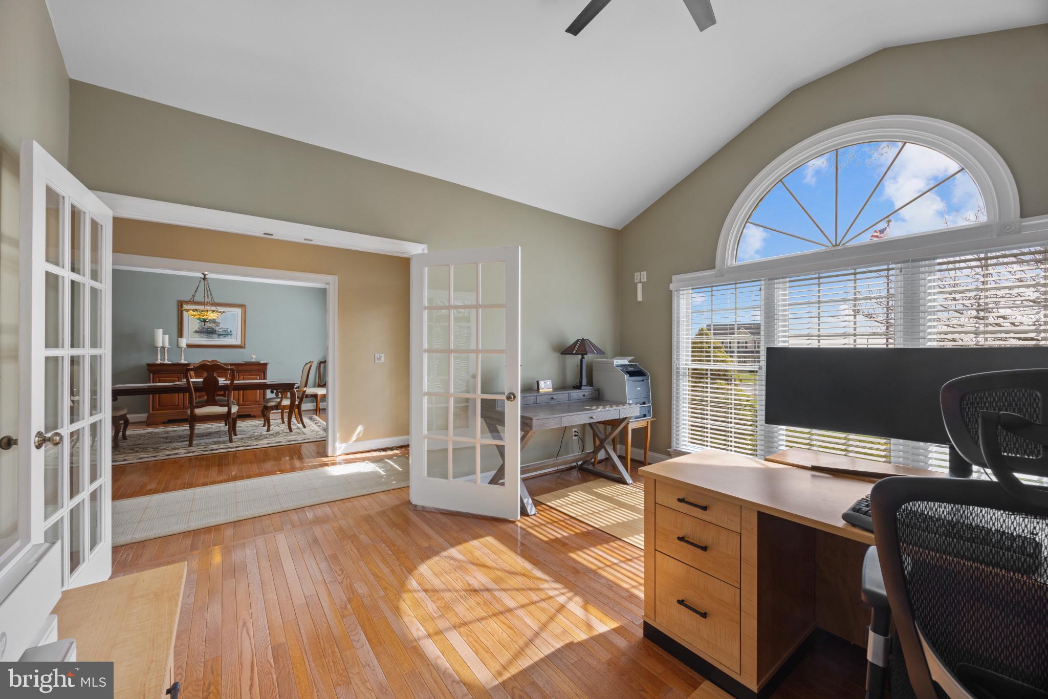 209 Beck Farm Road Centreville, MD 21617 - Photo 8 of 55 a view of a workspace with furniture and a window