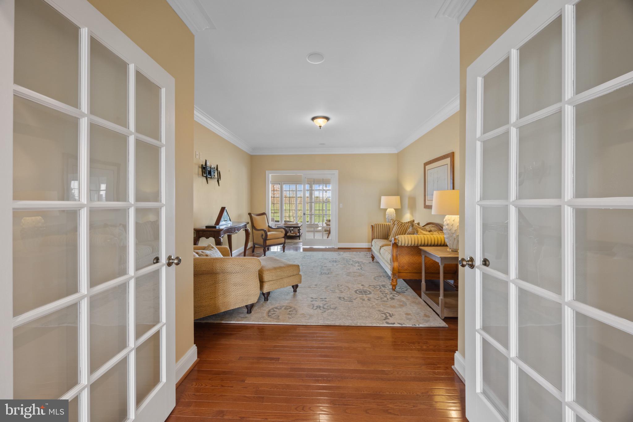 209 Beck Farm Road Centreville, MD 21617 - Photo 10 of 55 a living room with furniture window and wooden floor