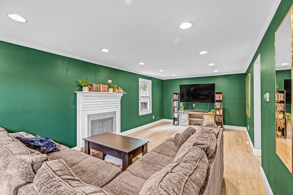6 Baird Trace Springfield, MA 01118 - Photo 2 of 27 a bedroom with a bed and a television in it