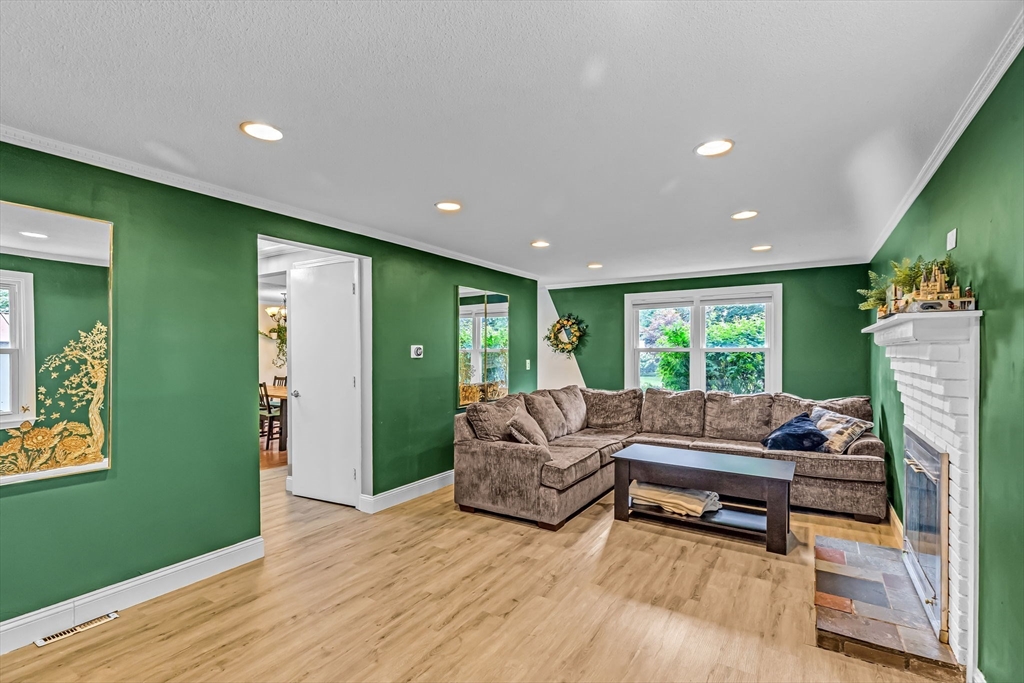 6 Baird Trace Springfield, MA 01118 - Photo 3 of 27 a living room with furniture and a open kitchen