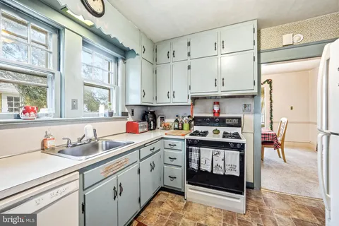 a kitchen with stainless steel appliances granite countertop a sink and cabinets