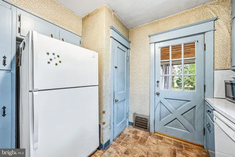 a white refrigerator freezer and a dishwasher in a kitchen