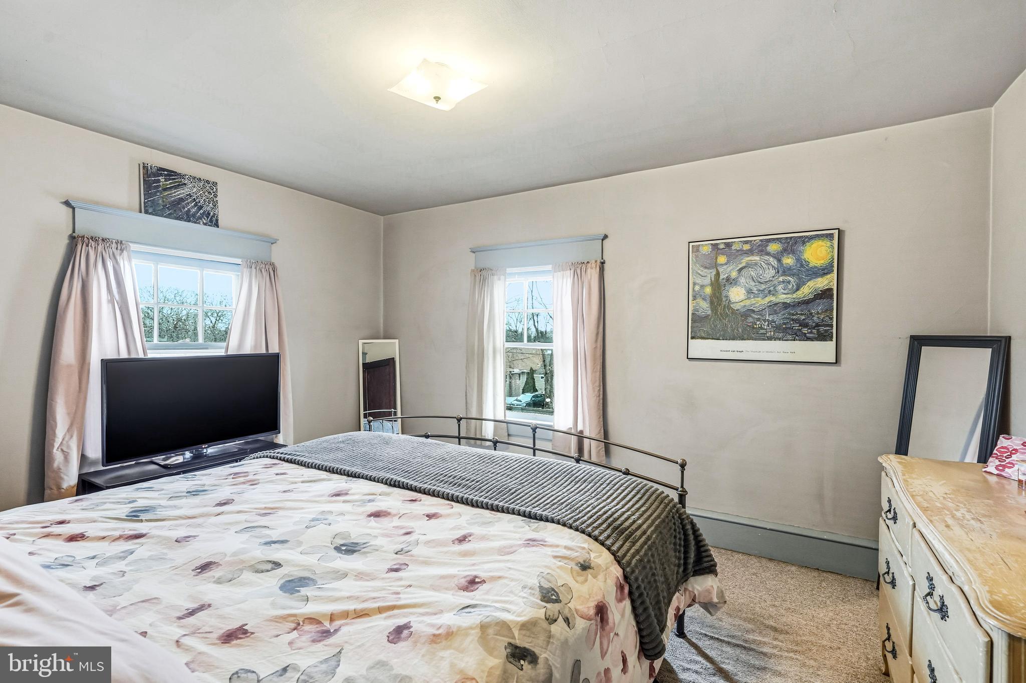 219 Harding Avenue Westmont, NJ 08108 - Photo 22 of 35 a bedroom with a bed and a flat screen tv