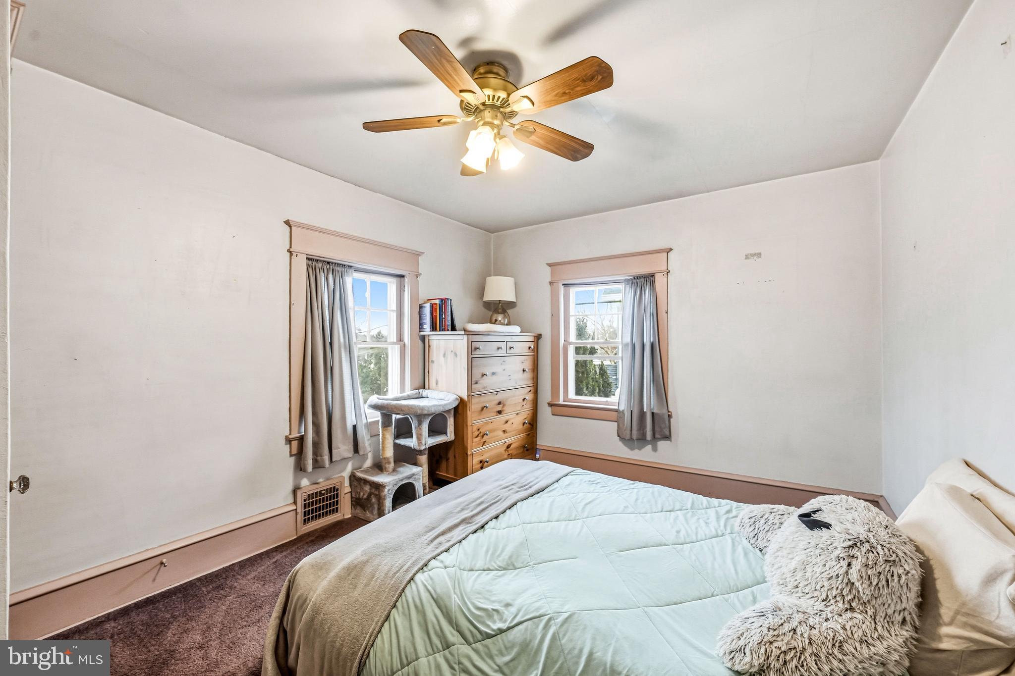 219 Harding Avenue Westmont, NJ 08108 - Photo 23 of 35 a bedroom with a large bed and a window