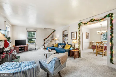a bedroom with furniture and a flat screen tv