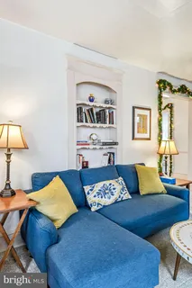 a bedroom with a bed and lamp