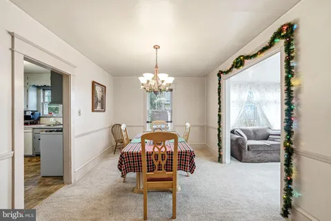 a bedroom with furniture and a chandelier