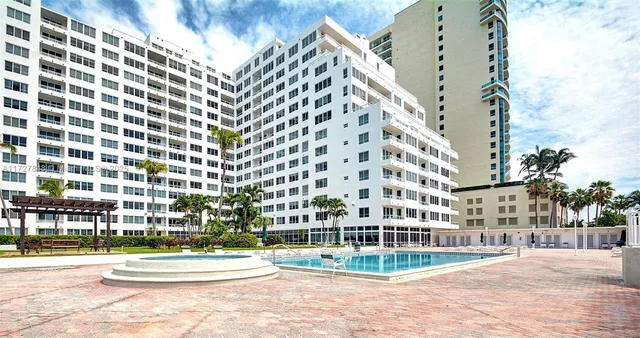 a view of a room with furniture and window
