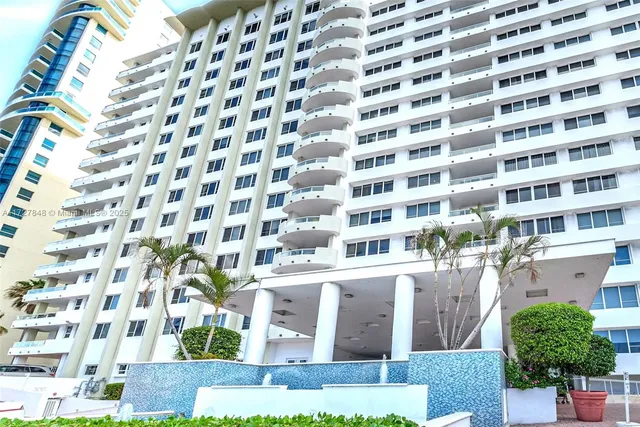 a livingroom with furniture and a chandelier