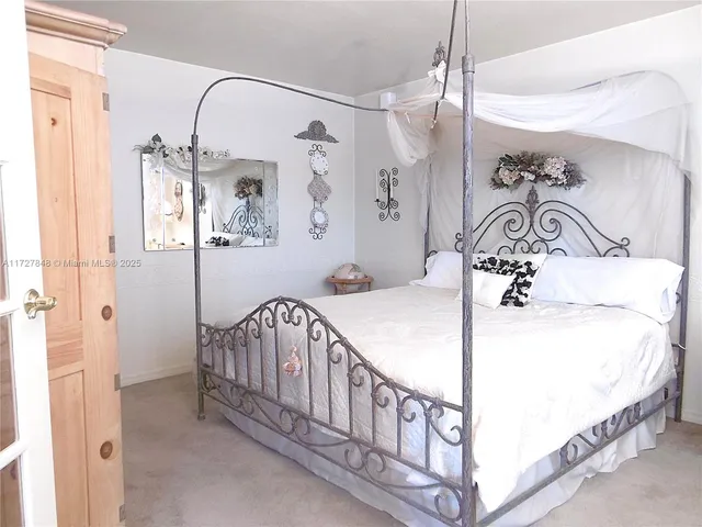a bathroom with a sink mirror and shower