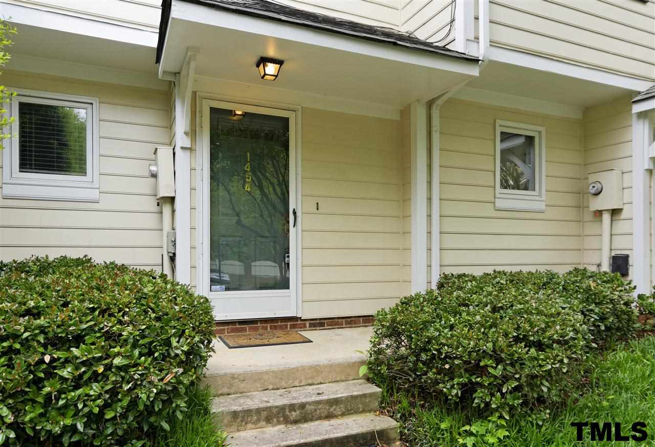 1454 Barton Pl Drive Raleigh, NC 27608 - Photo 1 of 25 a front view of a house with a yard