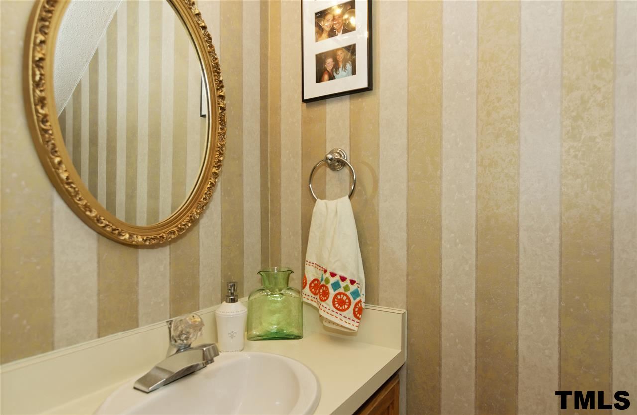 1454 Barton Pl Drive Raleigh, NC 27608 - Photo 12 of 25 a bathroom with a sink and a mirror