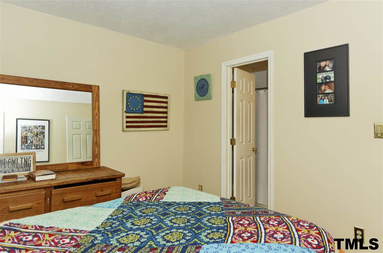 1454 Barton Pl Drive Raleigh, NC 27608 - Photo 19 of 25 a bedroom with two beds and a dresser