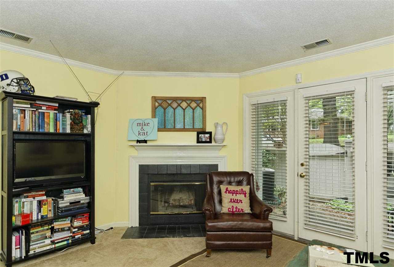 1454 Barton Pl Drive Raleigh, NC 27608 - Photo 3 of 25 a living room with furniture and a flat screen tv