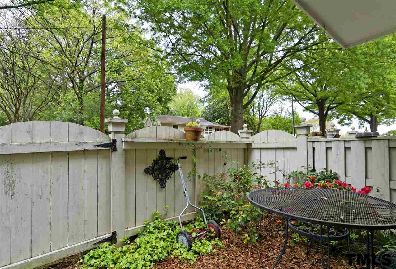 1454 Barton Pl Drive Raleigh, NC 27608 - Photo 22 of 25 a backyard of a house with table and chairs