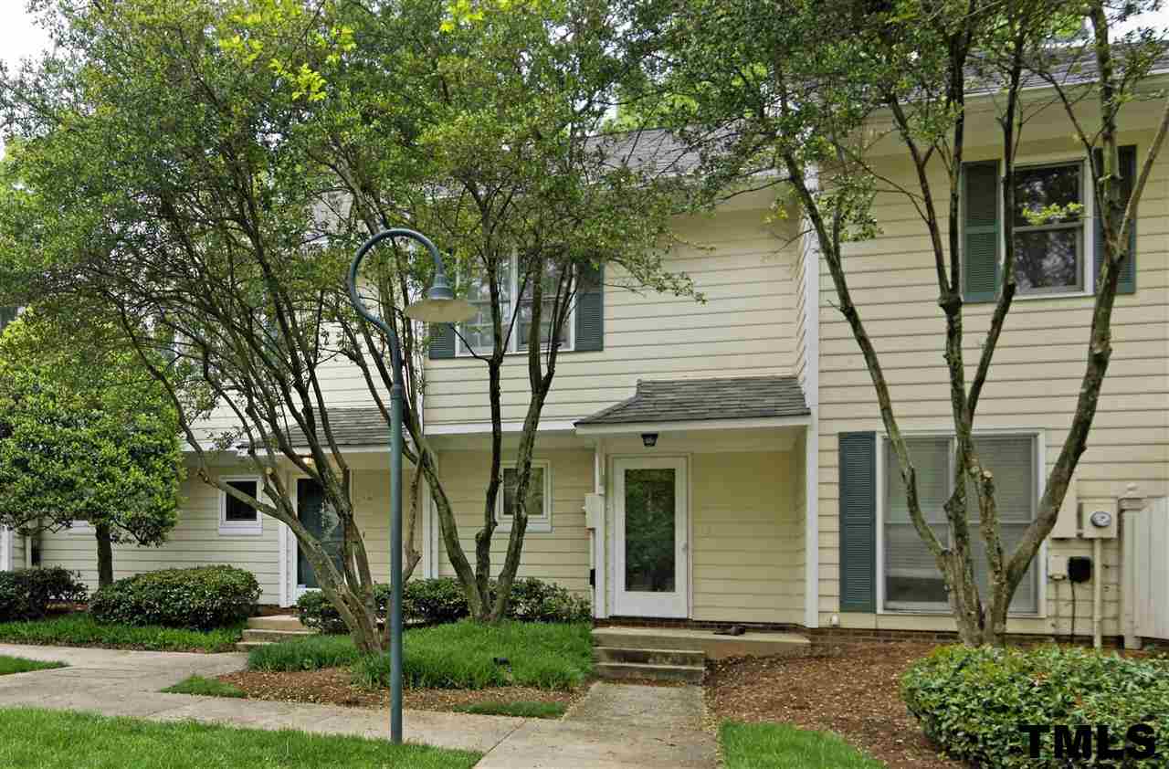 1454 Barton Pl Drive Raleigh, NC 27608 - Photo 23 of 25 front view of a house with a tree