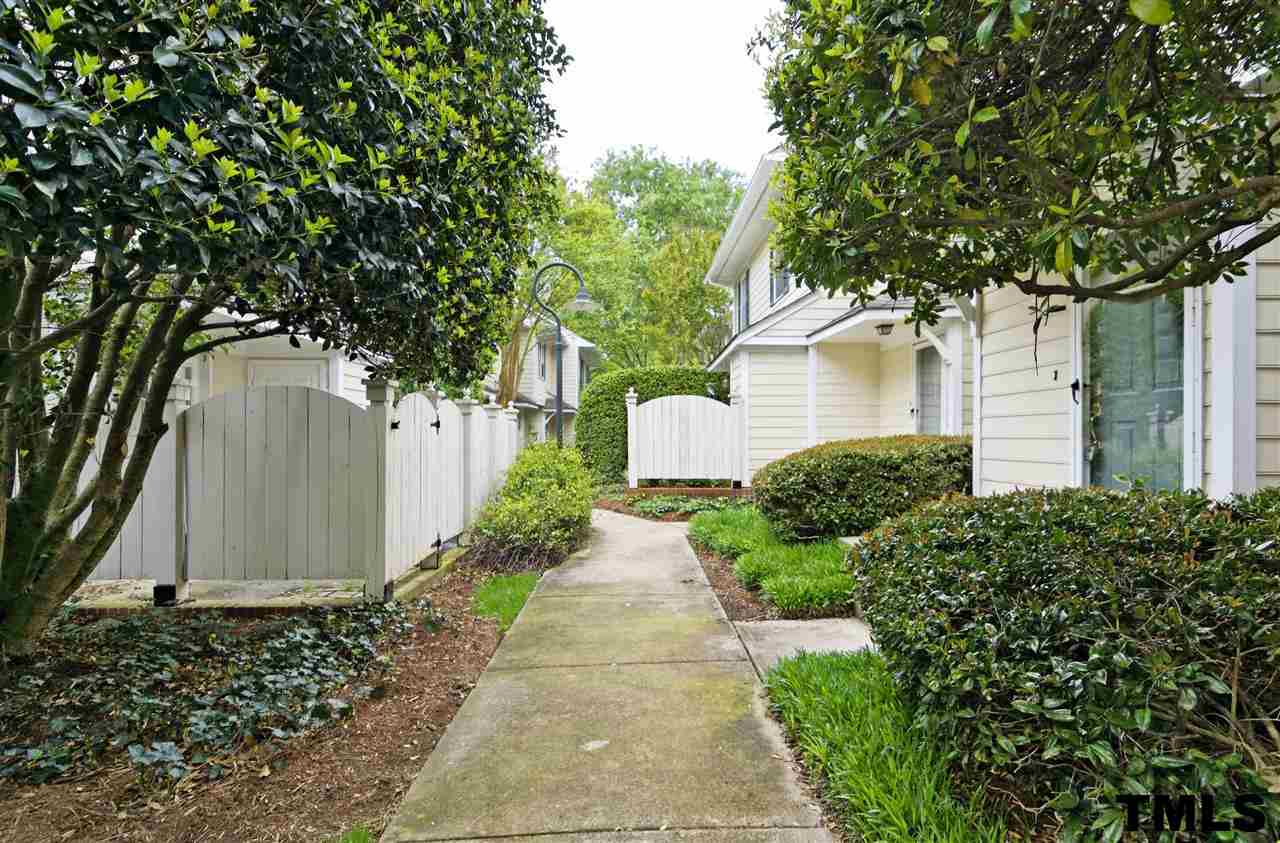 1454 Barton Pl Drive Raleigh, NC 27608 - Photo 24 of 25 a front view of a house with a yard and tree