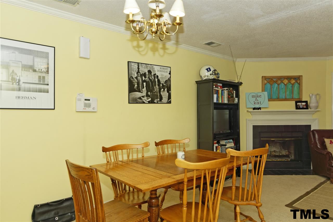 1454 Barton Pl Drive Raleigh, NC 27608 - Photo 7 of 25 a view of a dining room with furniture and a fireplace