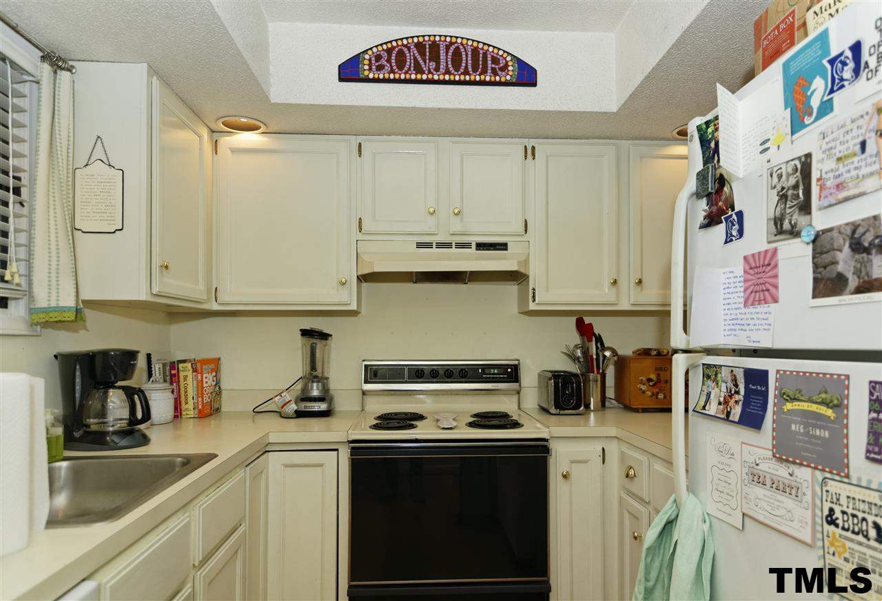 1454 Barton Pl Drive Raleigh, NC 27608 - Photo 10 of 25 a kitchen with stainless steel appliances granite countertop a stove and a sink