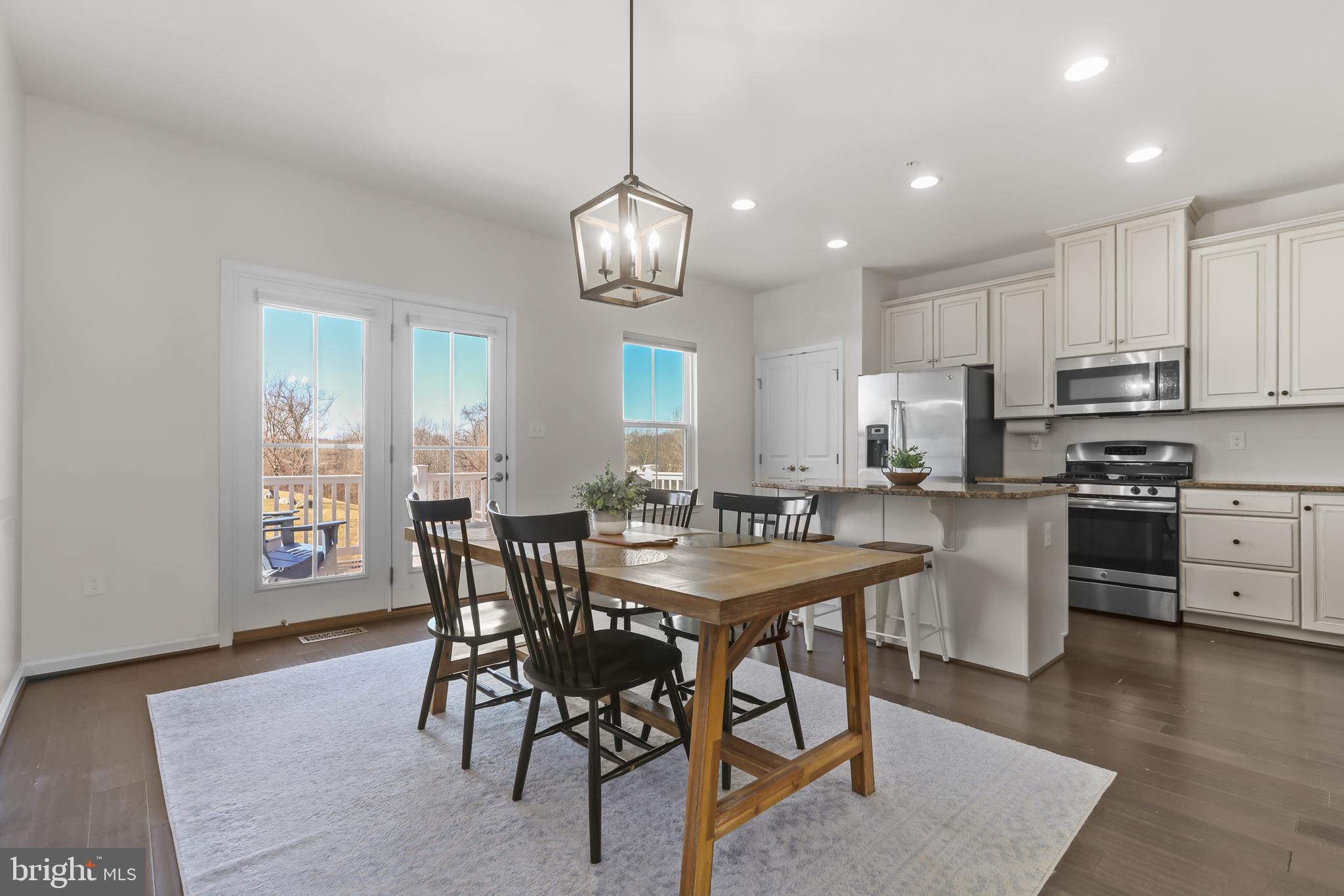 606 Buggy Ride Road Bel Air, MD 21014 - Photo 23 of 52 Dining Room with hardwood floors & slider to deck
