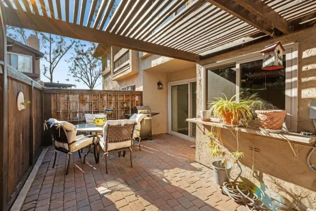 a patio with table and chairs