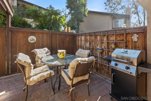 a outdoor dining space with furniture and outdoor view